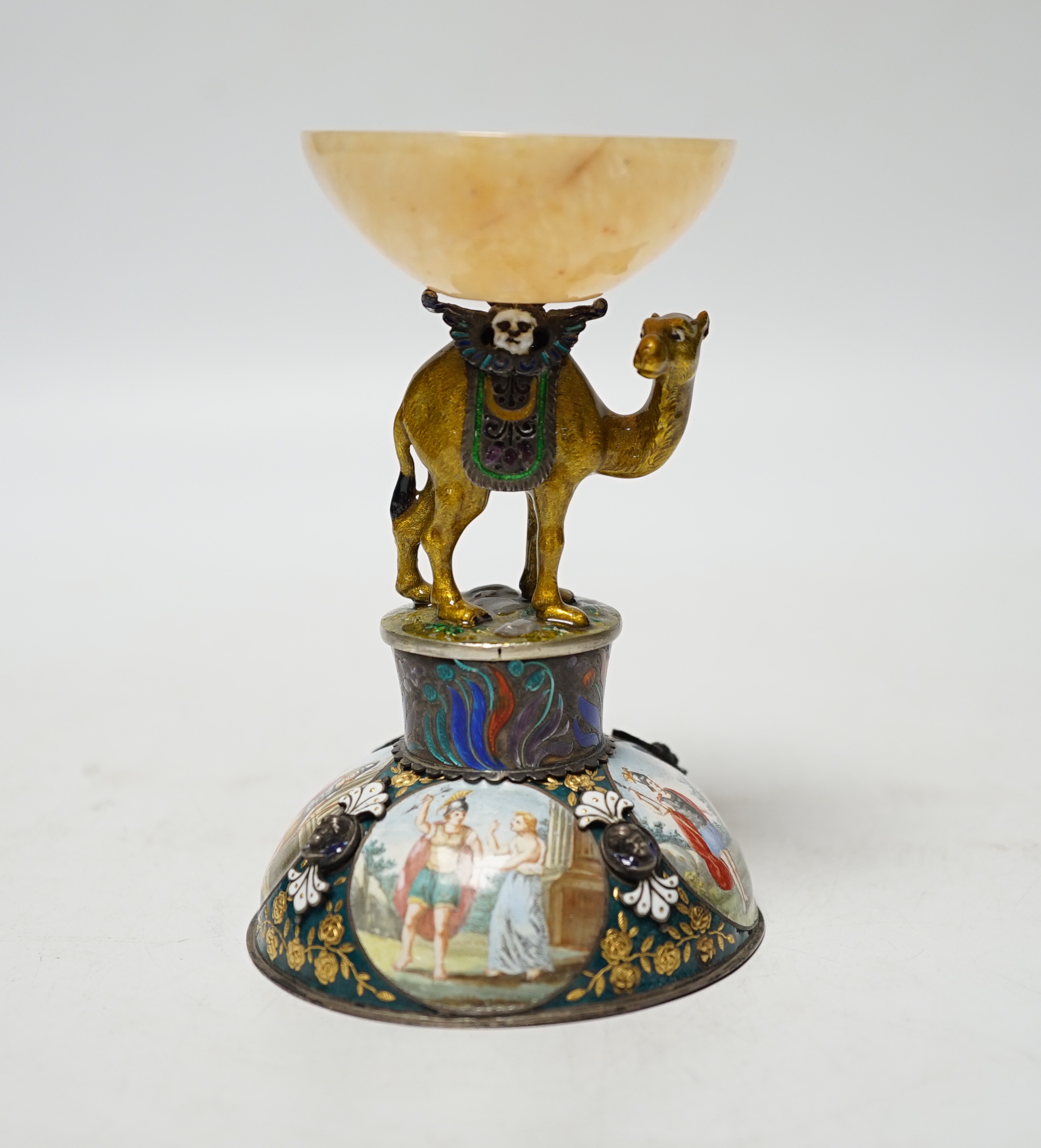 A 19th century Viennese? white metal, polychrome enamel and onyx mounted small centrepiece decorated with figural scenes, the stem in the form of a camel, height 10.7cm.